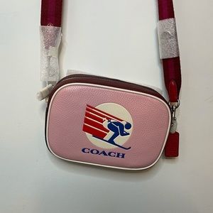 Burgundy,pink,white and blue Coach cross body.